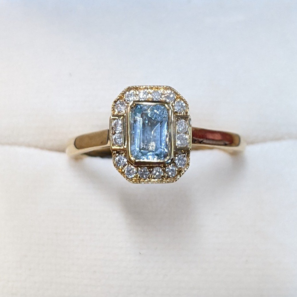9ct Yellow Gold Sky Blue Topaz & Diamond Halo Ring - Howells Jewellers